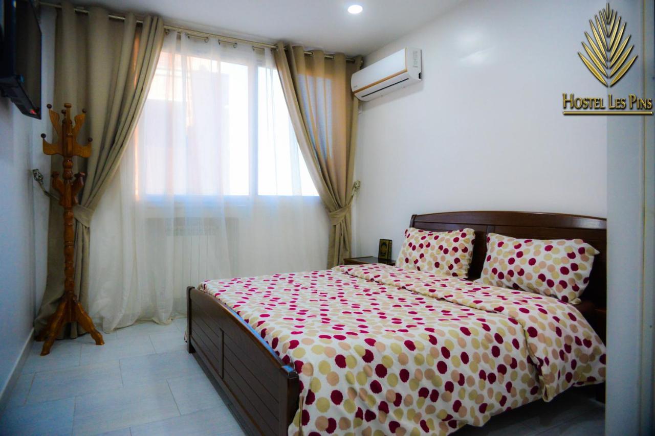 Hostel Les Pins Alger Bagian luar foto
