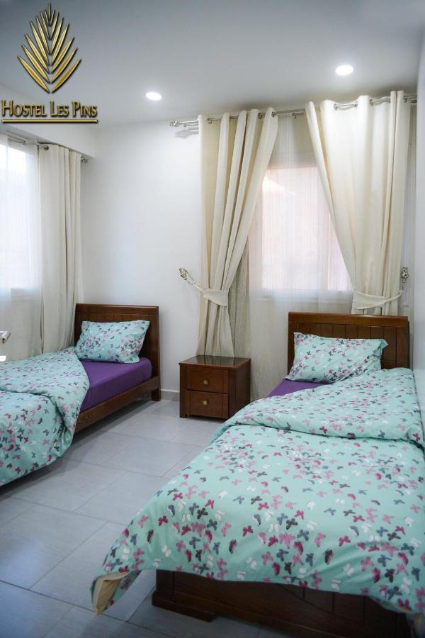 Hostel Les Pins Alger Bagian luar foto
